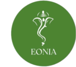 Deidad estilizada blanca parecida a un elefante en un círculo verde con la palabra 