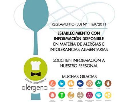 Un cartel con una cuchara y un gorro de cocinero.