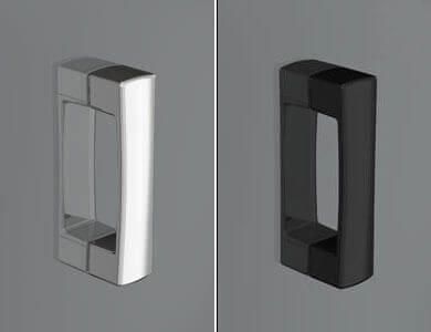 Dos manijas de puerta rectangulares, una plateada y otra negra, montadas sobre una superficie gris.