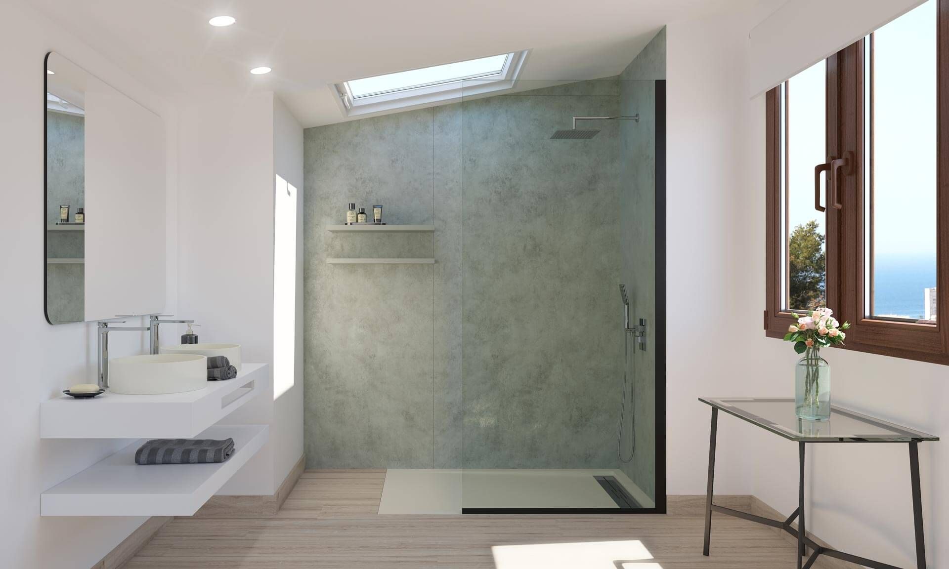 Plato de ducha gris oscuro con desagüe, junto a un panel de vidrio. Azulejos grises y blancos al fondo.