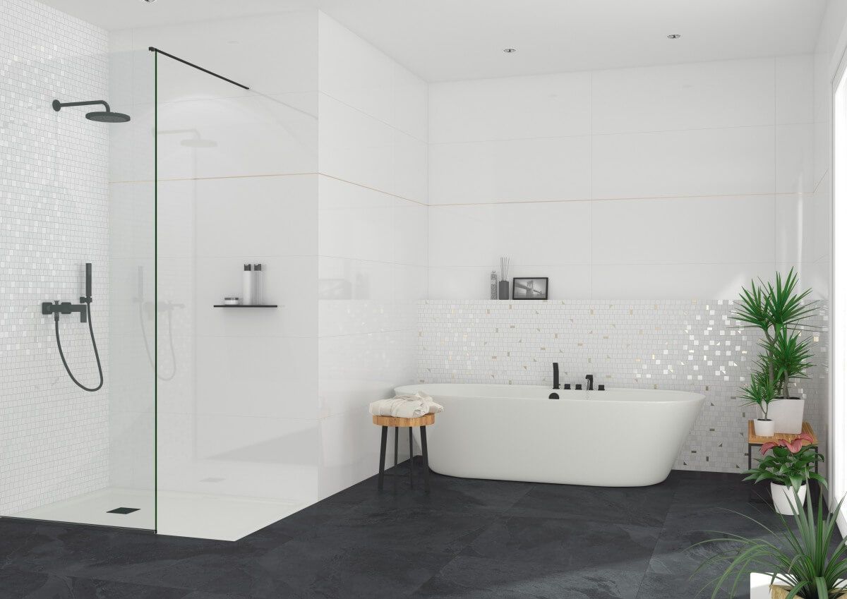 Baño blanco moderno con detalles en negro, ducha, bañera y plantas.