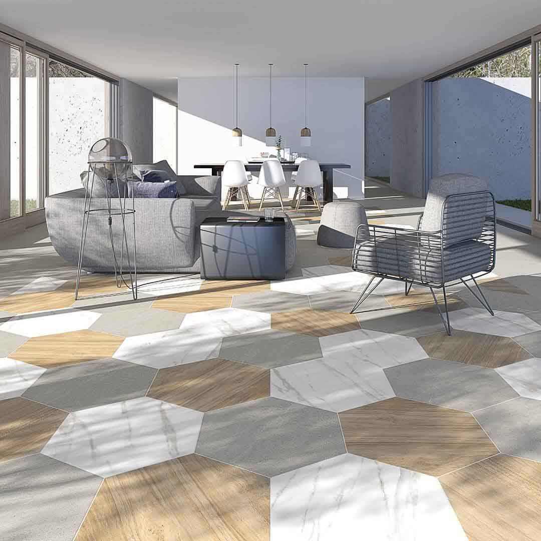 Moderna sala de estar con piso de baldosas hexagonales, muebles y grandes ventanales.