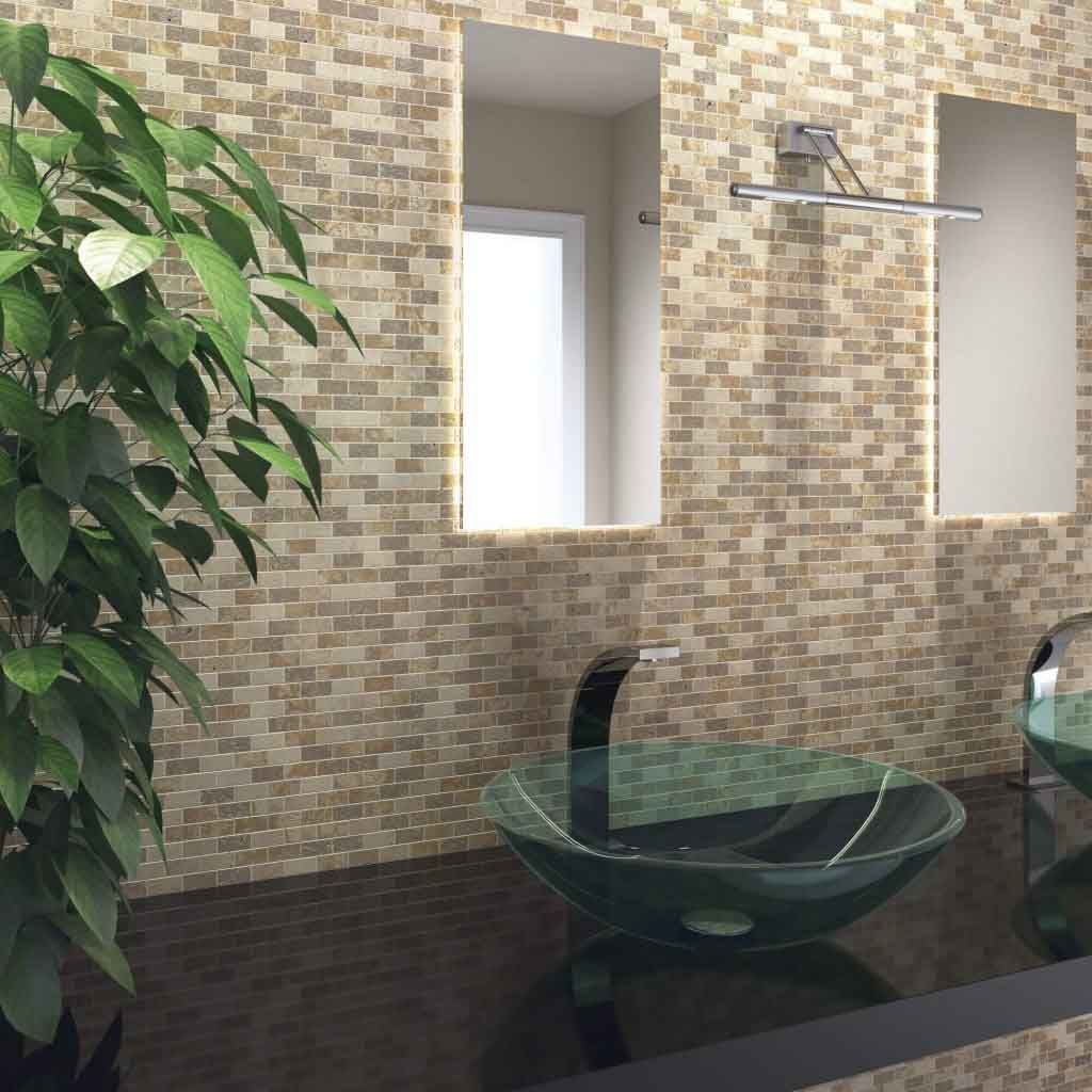 Baño con pared de mosaico, lavabo de cristal y planta.