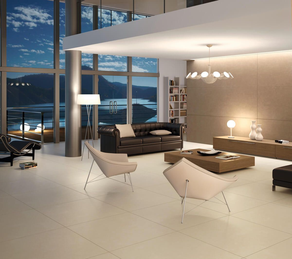 Moderna sala de estar con sofá de cuero, sillas beige, grandes ventanales y vista al exterior.