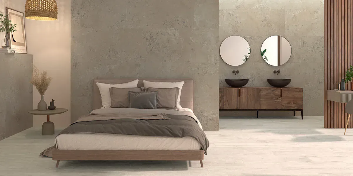 Dormitorio con cama, tocador y lavabo. Decoración en tonos tierra.