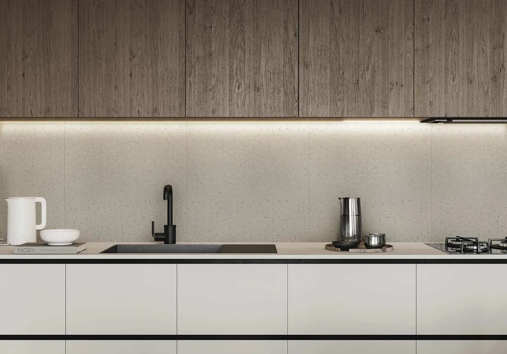 Cocina moderna con gabinetes blancos, salpicadero moteado y grifo oscuro.