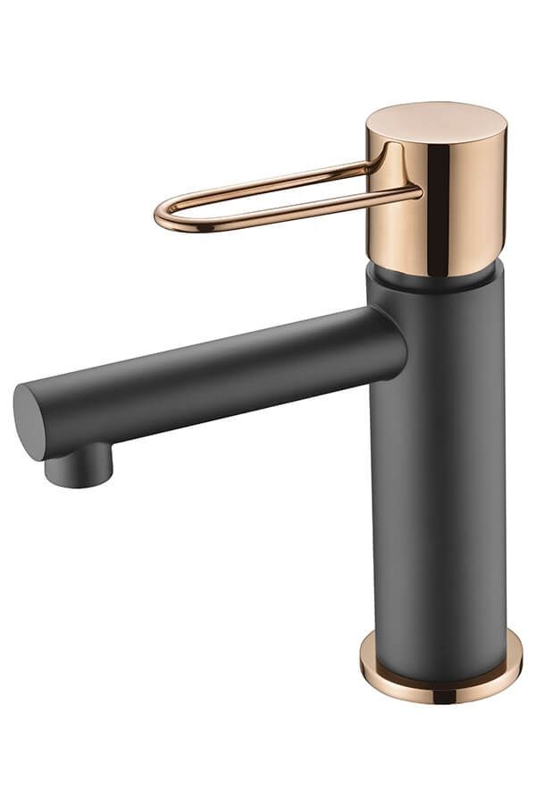 Grifo de baño en color negro y oro rosa.