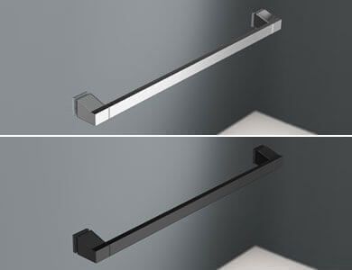 Dos toalleros: uno plateado y otro negro, montados en una pared gris.