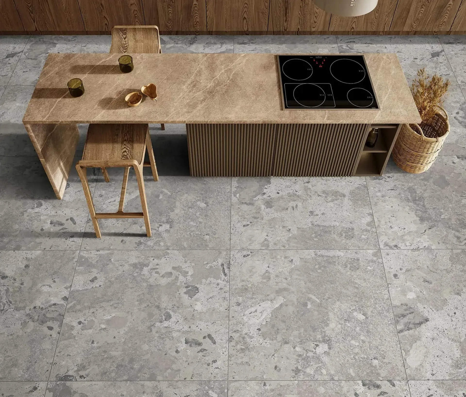 Isla de cocina con placa de cocina, taburete y suelo texturizado. Tonos madera clara y gris.