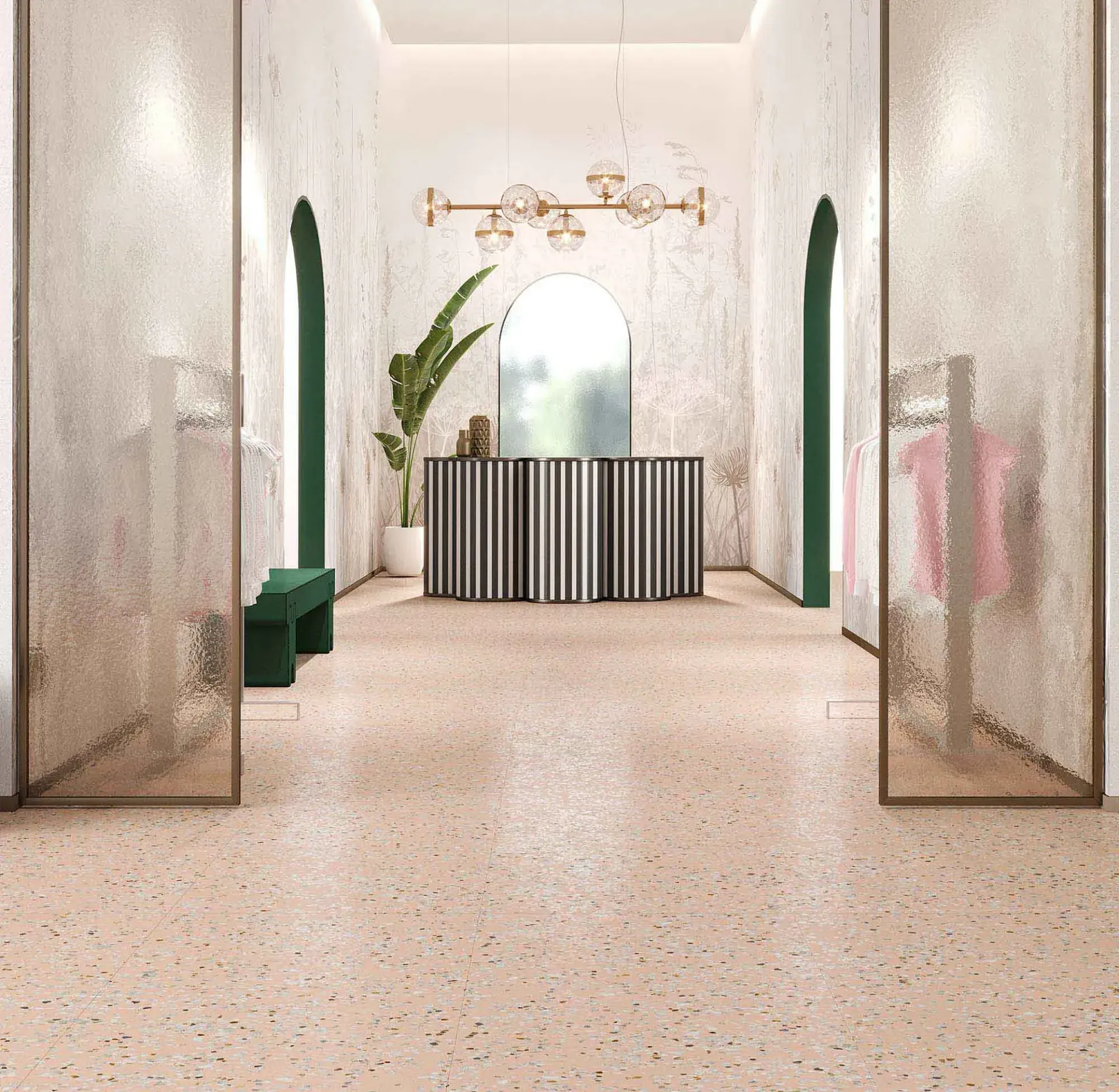 Interior de una boutique con puertas de vidrio texturizado y suelo moteado rosa. Incluye puertas arqueadas y un mostrador a rayas.