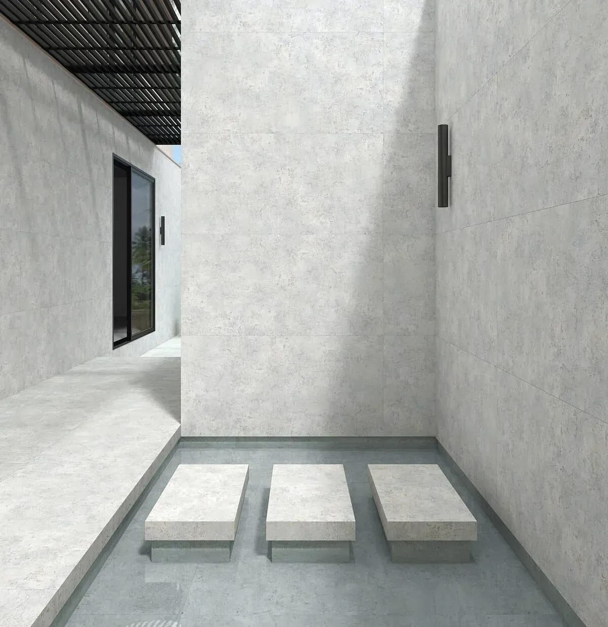 Espacio exterior moderno con paredes de hormigón, fuente de agua y escalones.