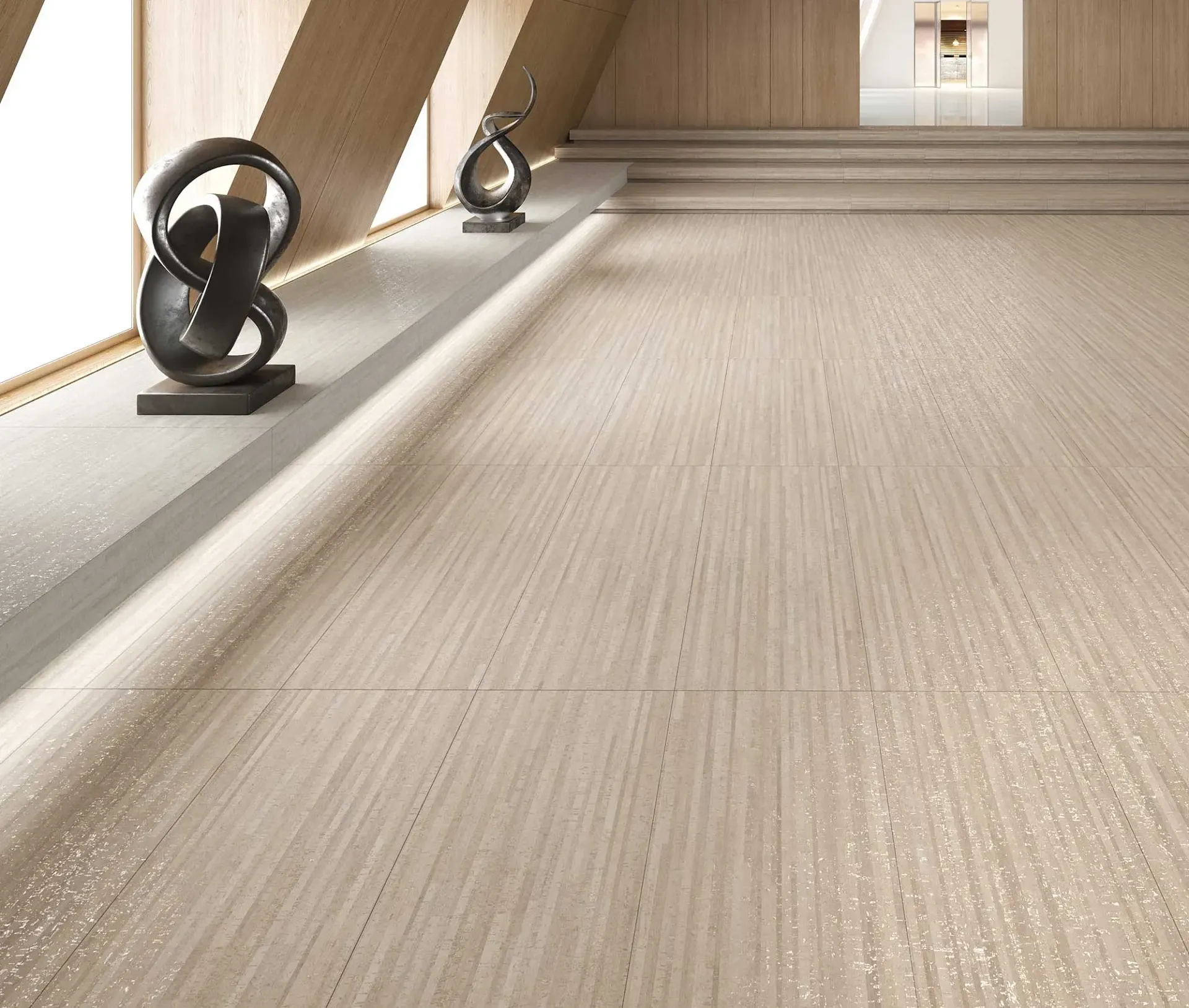 Interior arquitectónico moderno con paredes y suelos de madera clara, esculturas y escalones.