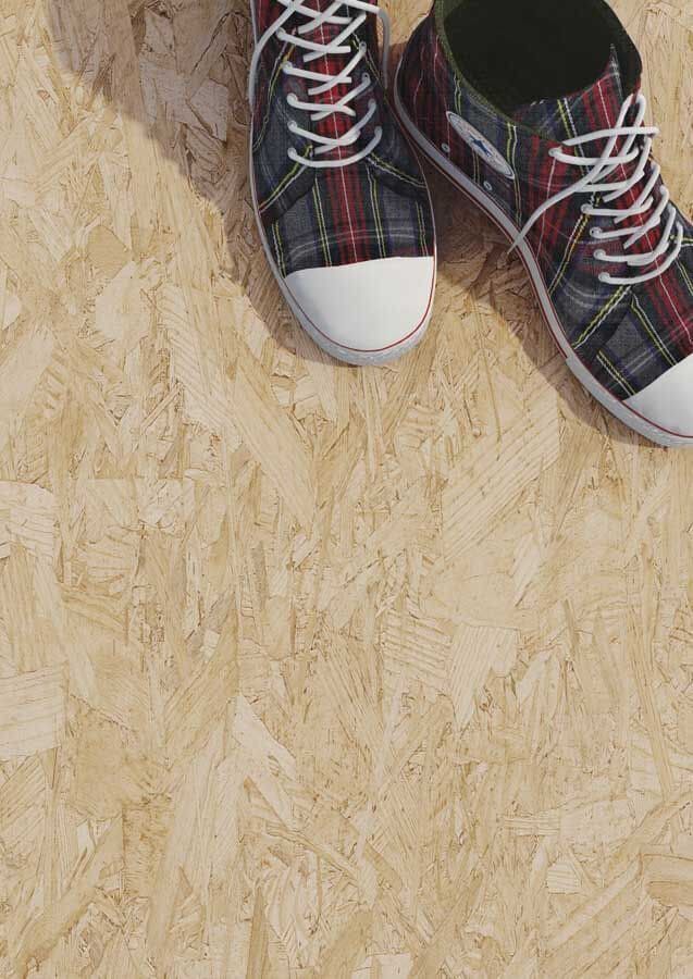 Par de zapatillas a cuadros con puntera blanca sobre una superficie texturizada de madera clara.