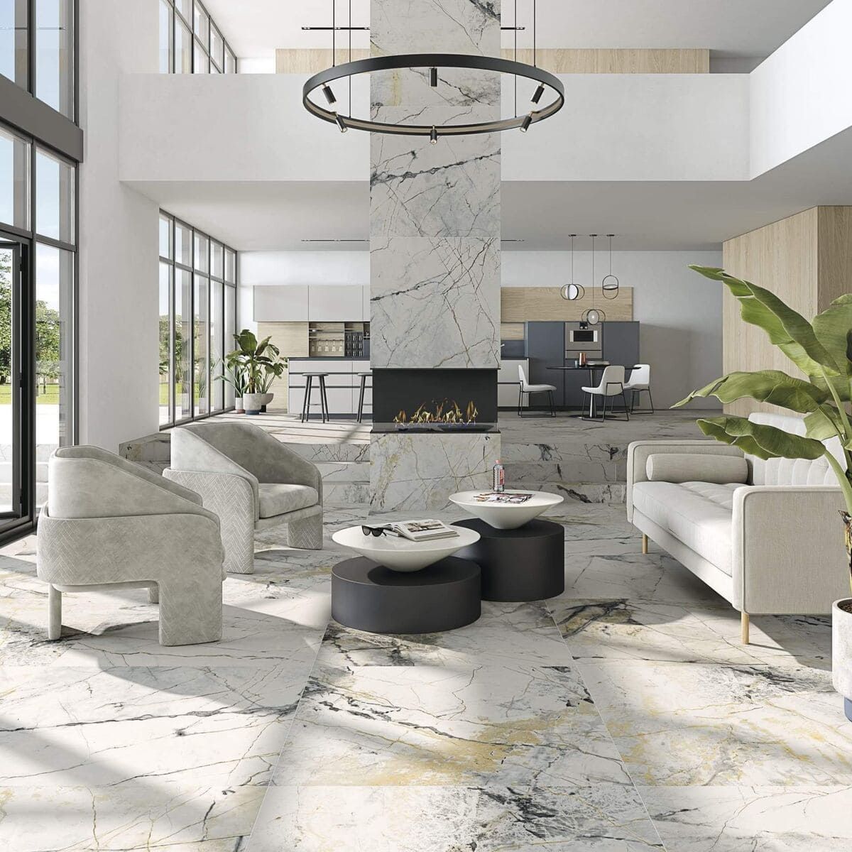 Amplia sala de estar moderna con pisos de mármol, chimenea, asientos y vista al área de la cocina.