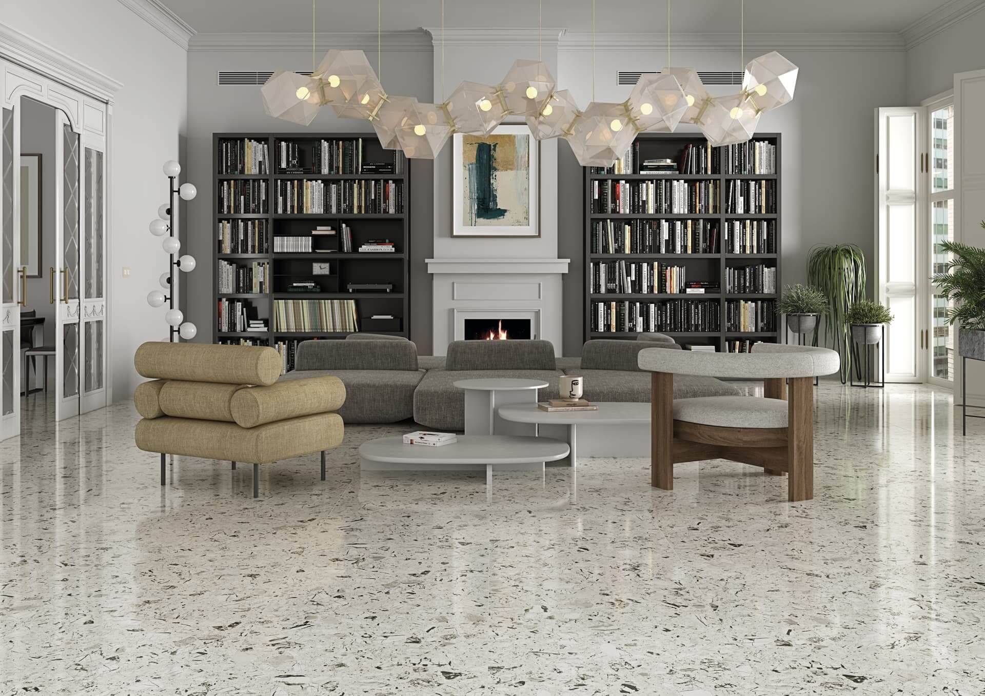 Sala de estar con suelo de terrazo, estanterías, chimenea, muebles modernos y una gran lámpara de araña.