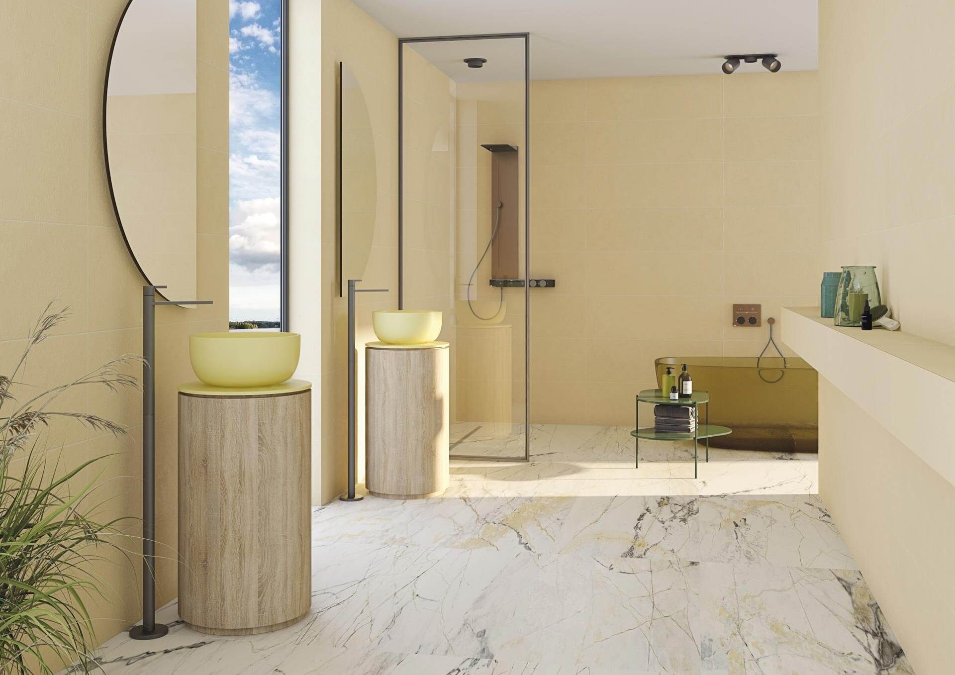 Baño moderno con paredes amarillas, suelo de mármol y ducha de cristal.