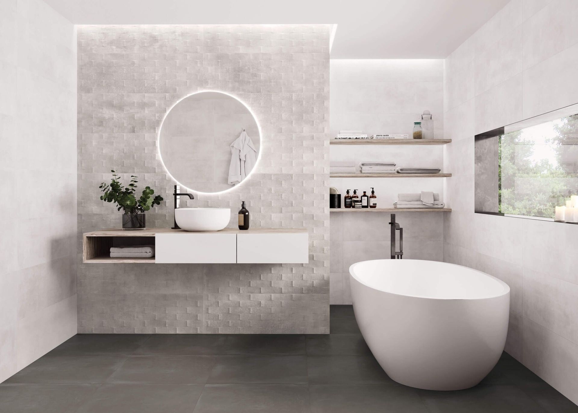 Baño moderno con espejo redondo, tocador flotante y bañera independiente.