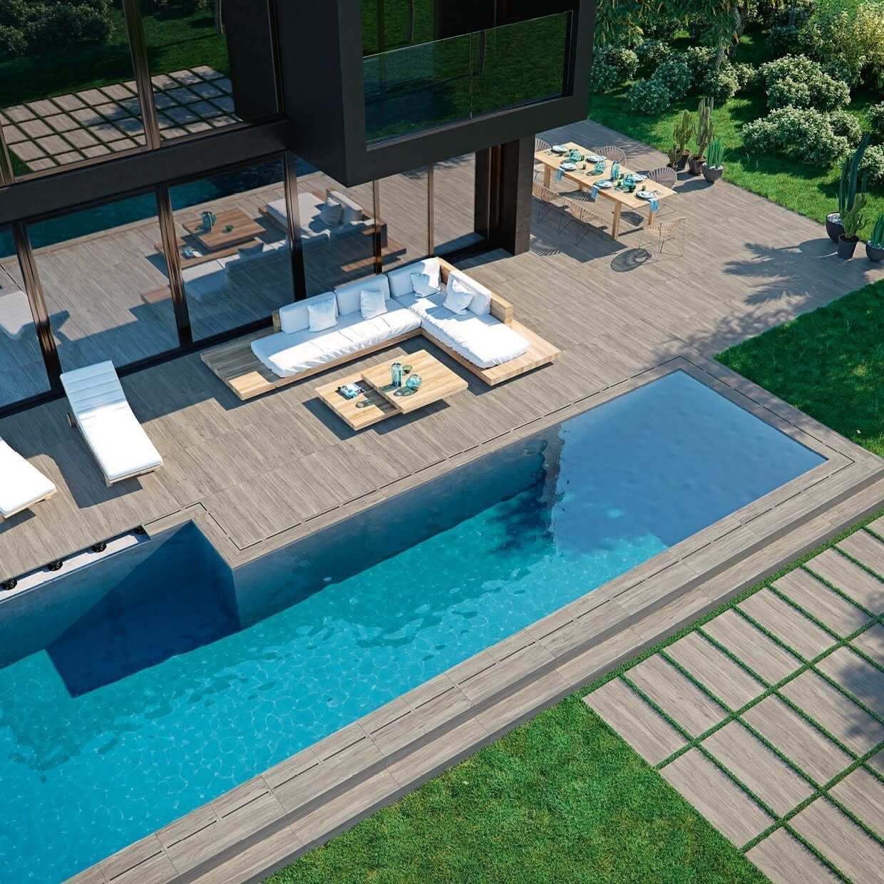 Casa moderna con piscina, terraza, asientos al aire libre y exuberante vegetación.