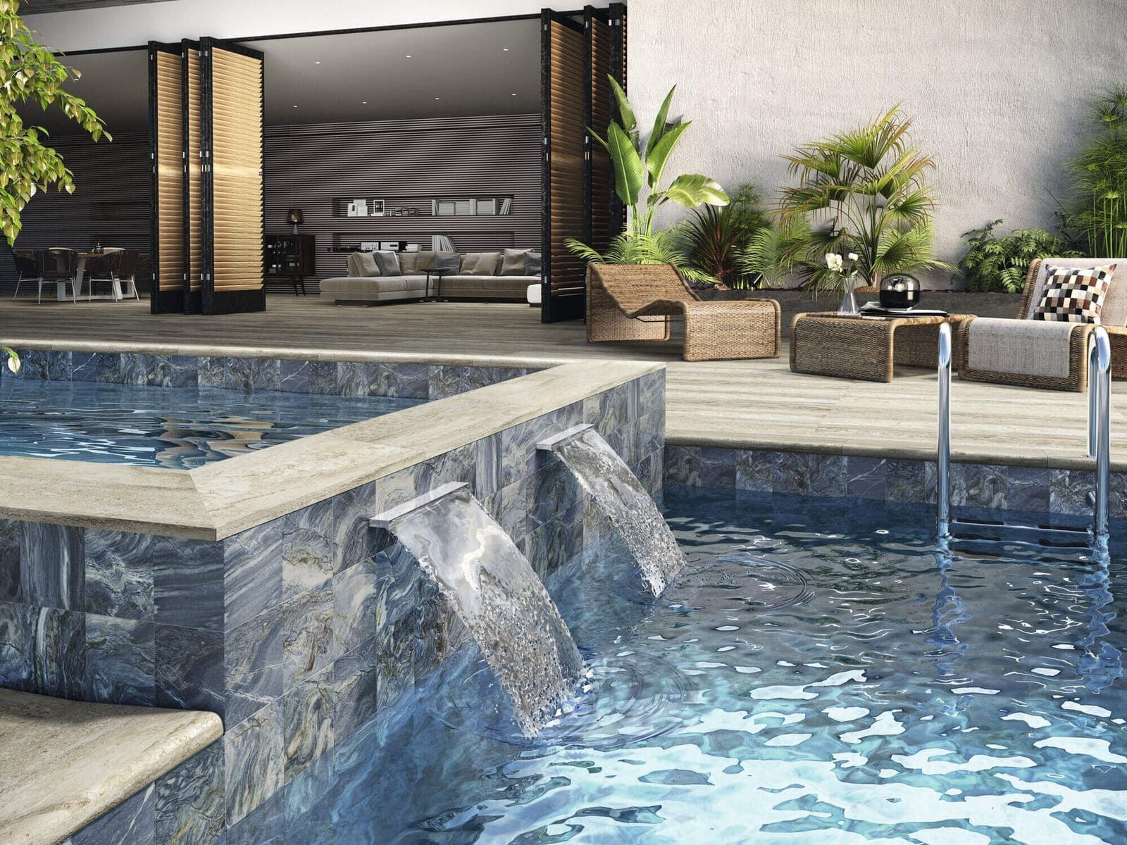 Piscina con cascadas, muebles de patio y puerta parcialmente abierta al interior.