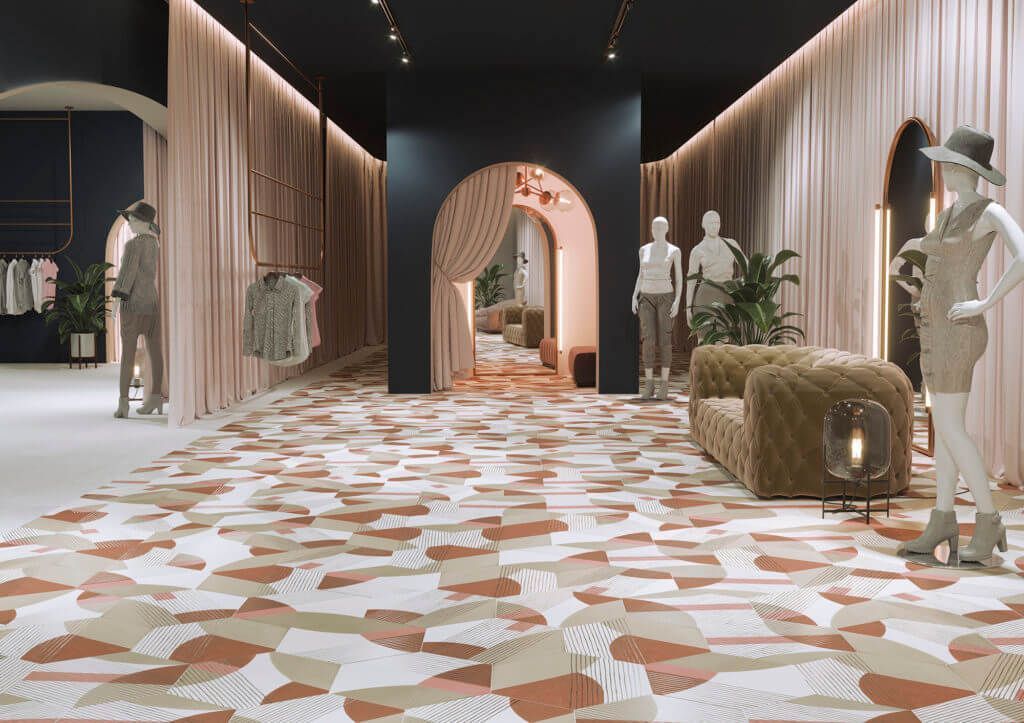 Interior de una tienda de ropa con maniquíes, expositores y suelo estampado. Combinación de colores melocotón y negro.