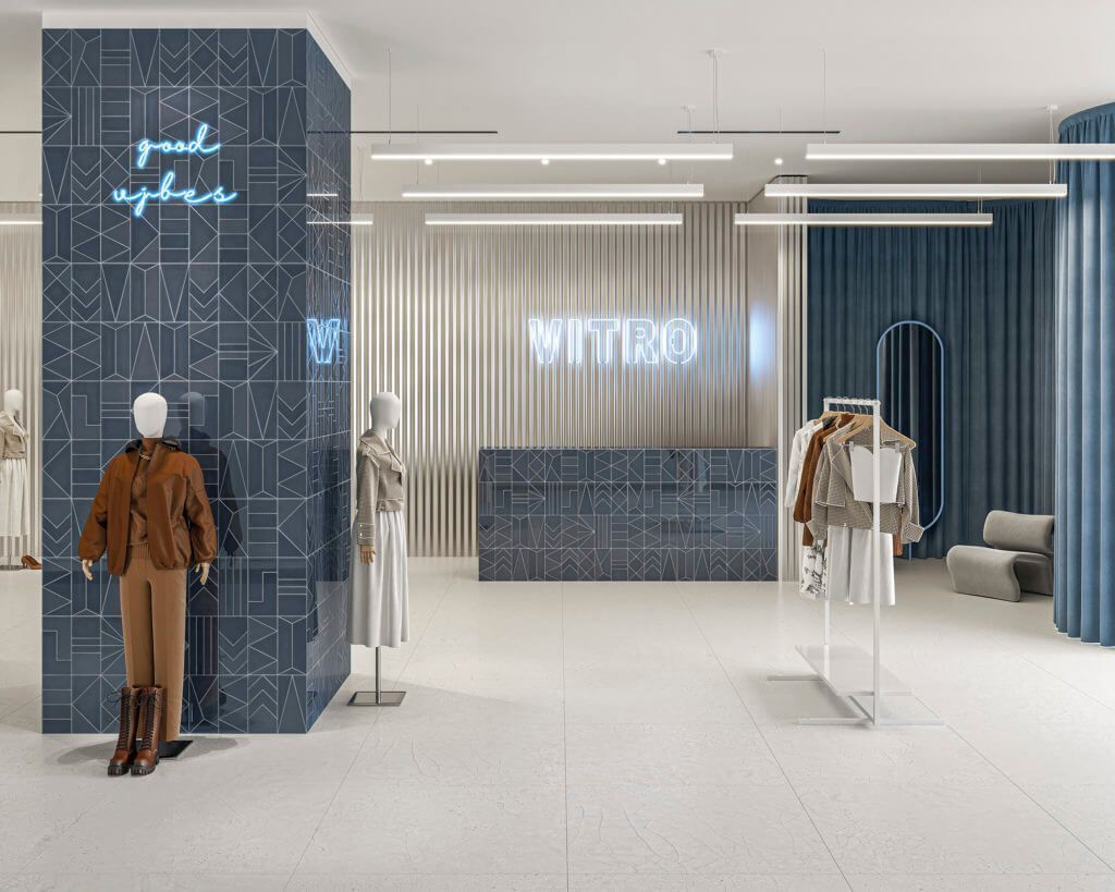 Interior de una tienda de ropa con maniquíes, expositores y mostrador de recepción. Combinación de colores azul y blanco.