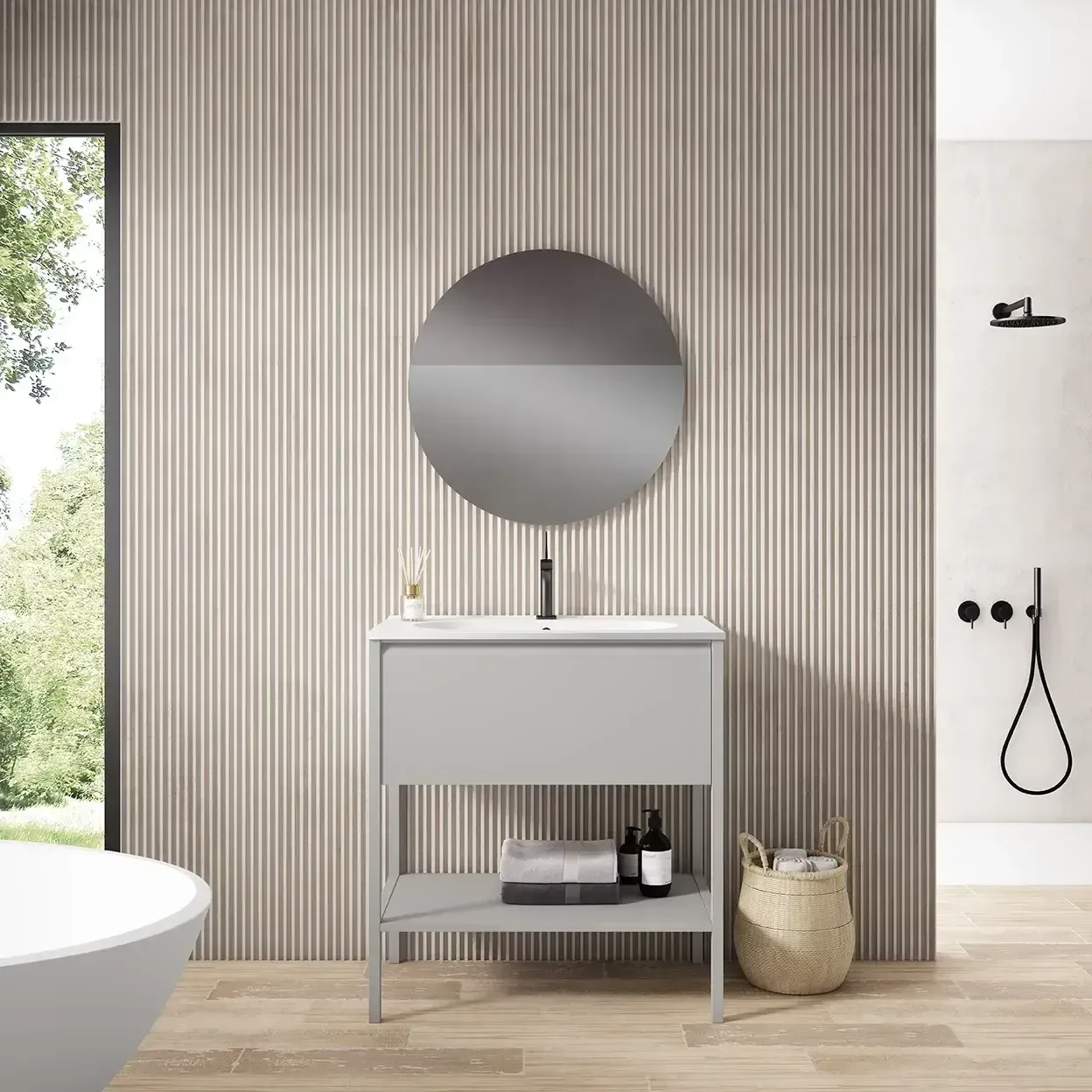 Baño con tocador gris, espejo redondo y pared texturizada.