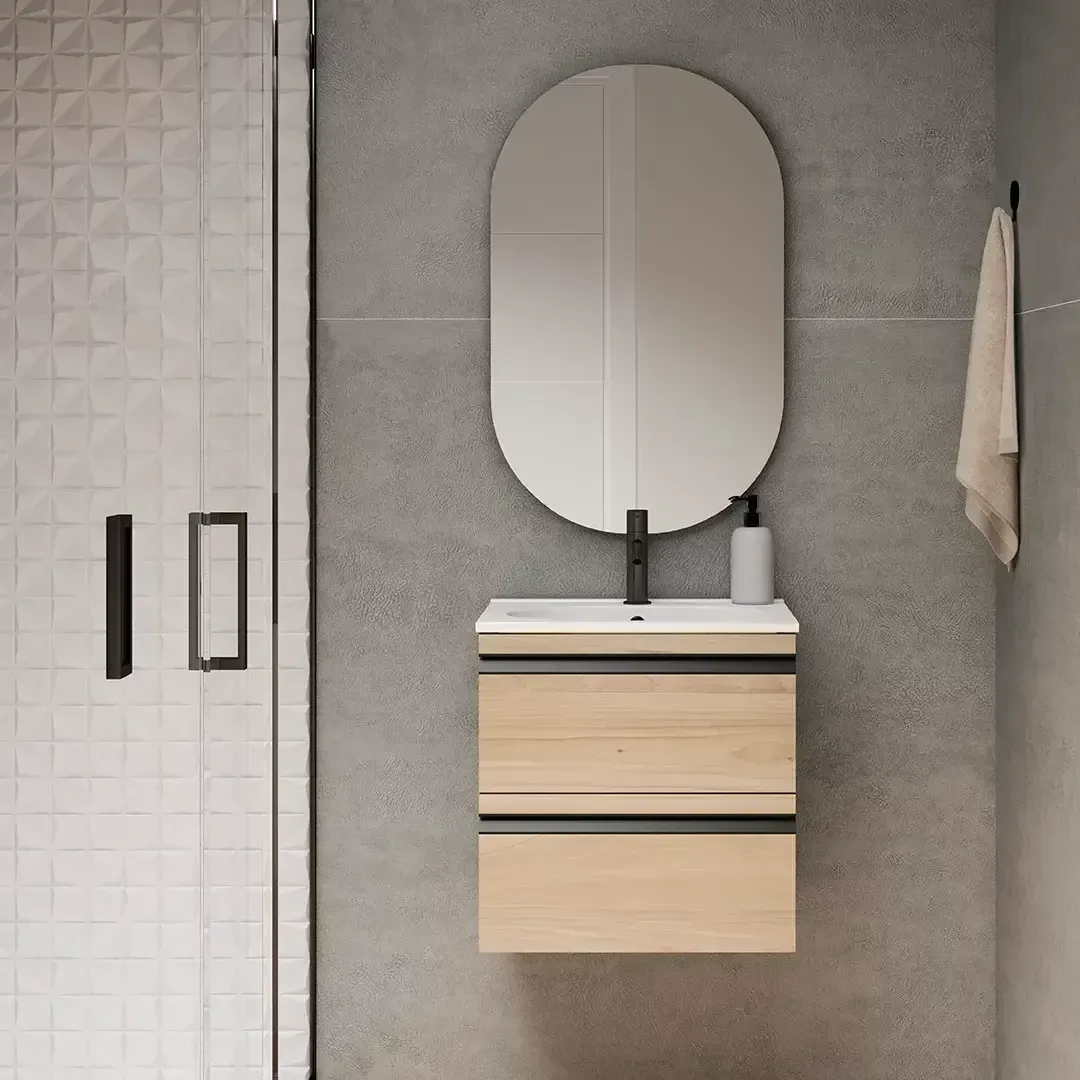 Mueble de baño con mueble de madera, espejo ovalado y toallero colgado en la pared.