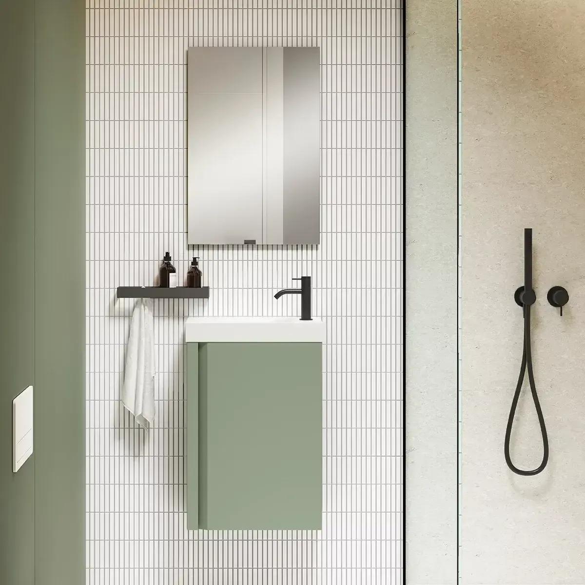 Tocador de baño moderno verde con espejo, grifo negro, ducha y toallero.