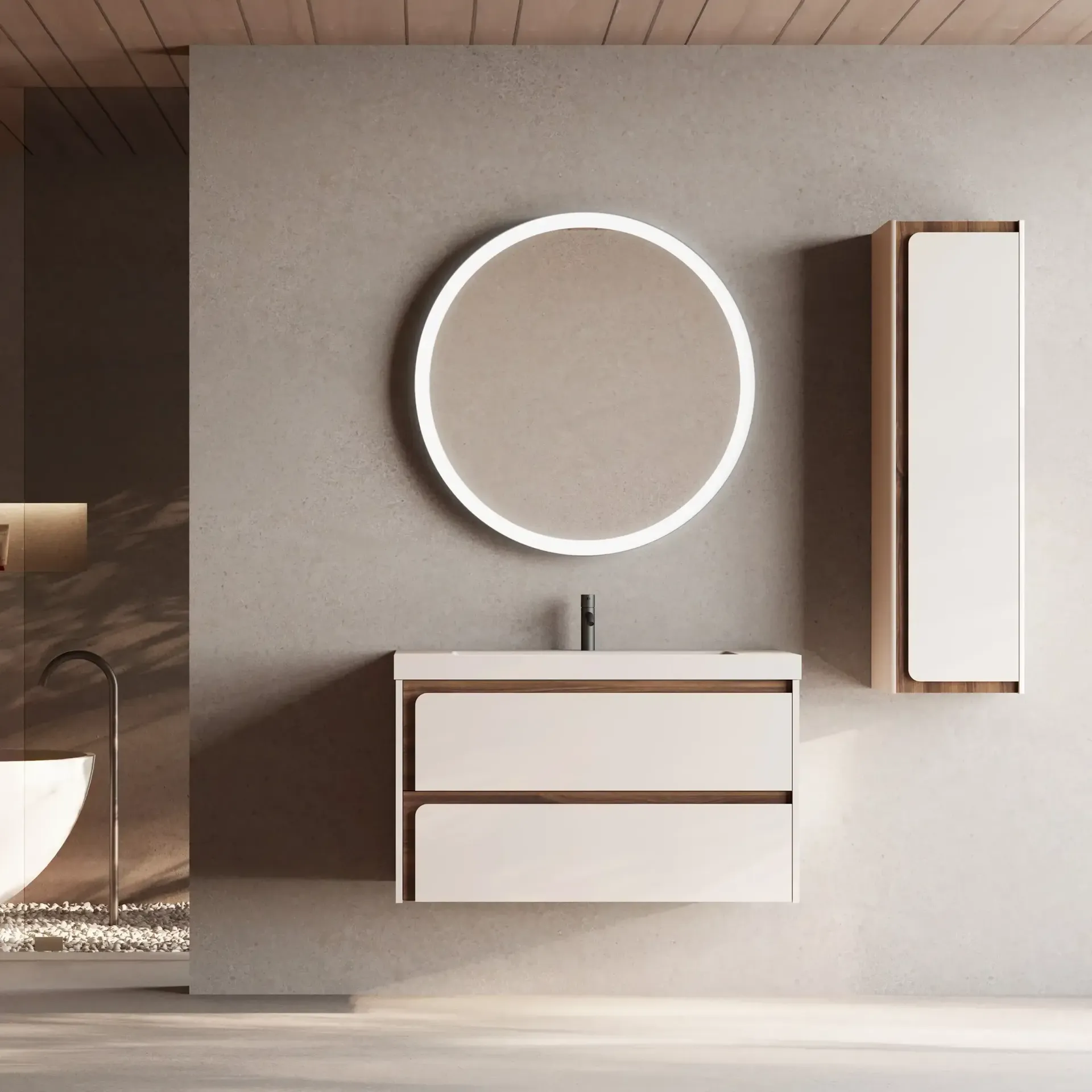 Baño moderno con espejo redondo, tocador y mueble alto.