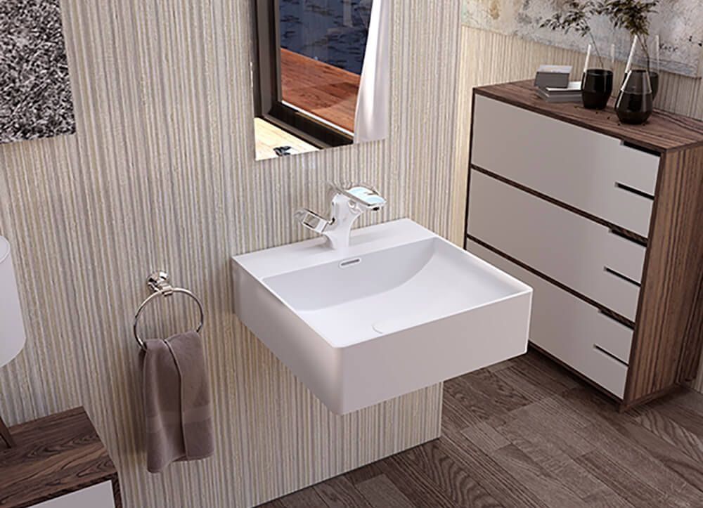 Baño moderno con lavabo flotante blanco, grifo, espejo, mueble de madera y toallero de aro.