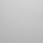 Superficie gris texturizada, posiblemente piedra o material rugoso.