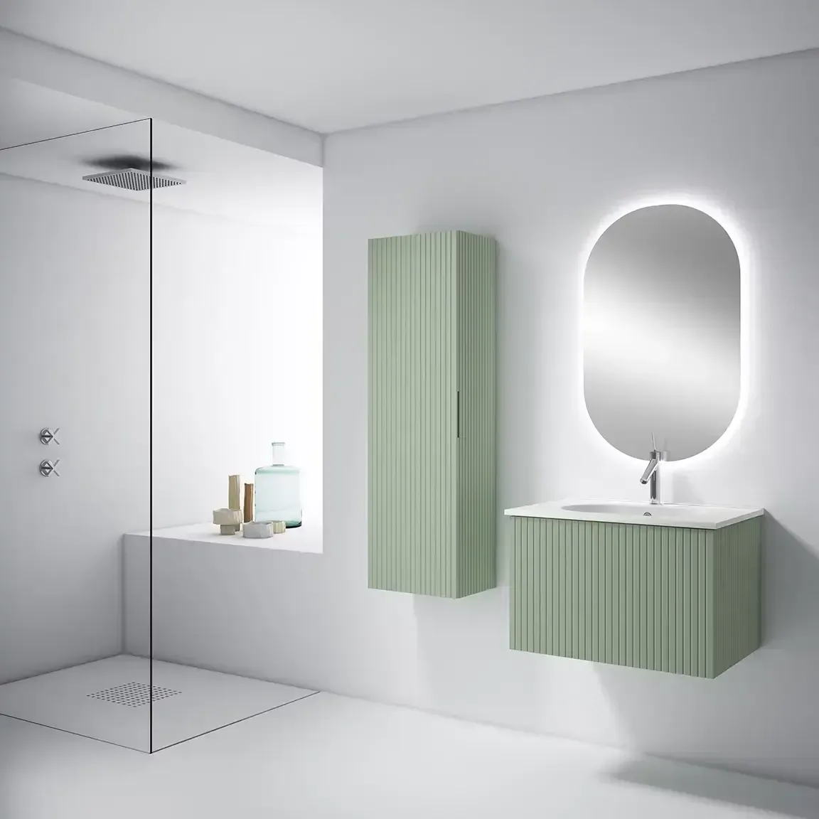 Baño moderno con tocador verde claro, mueble alto, espejo ovalado y ducha.