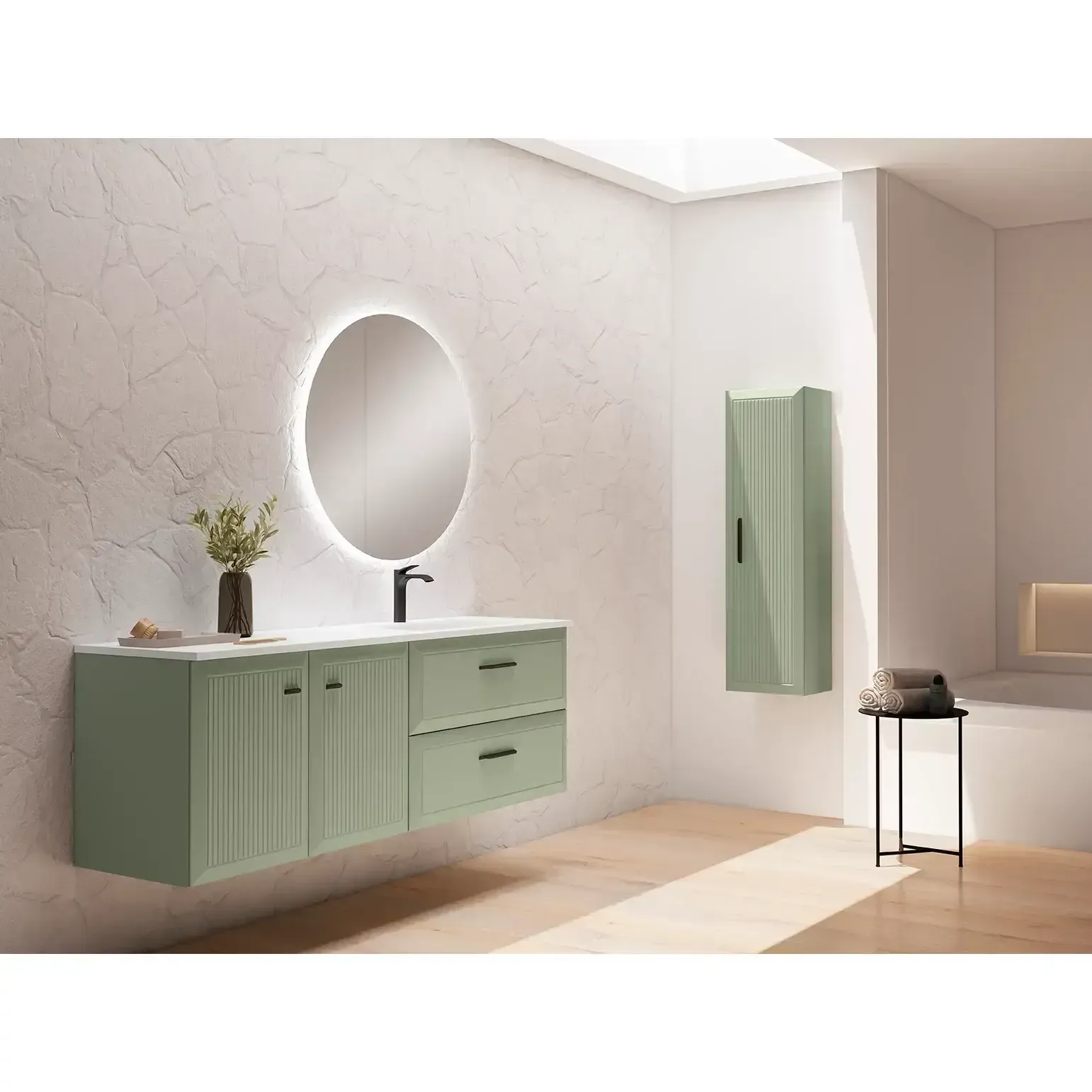 Tocador de baño verde con espejo ovalado, mueble de pared y mesa auxiliar.