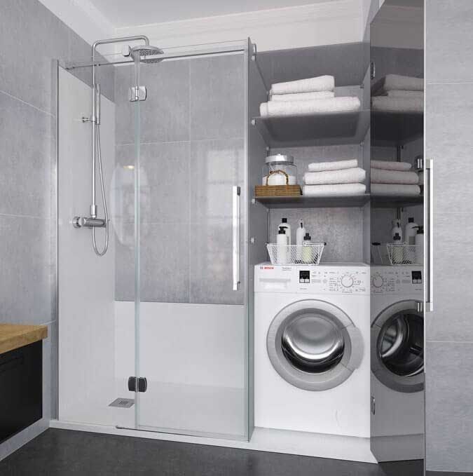 Baño con ducha, lavadora y secadora, estantes con toallas y mueble oscuro.