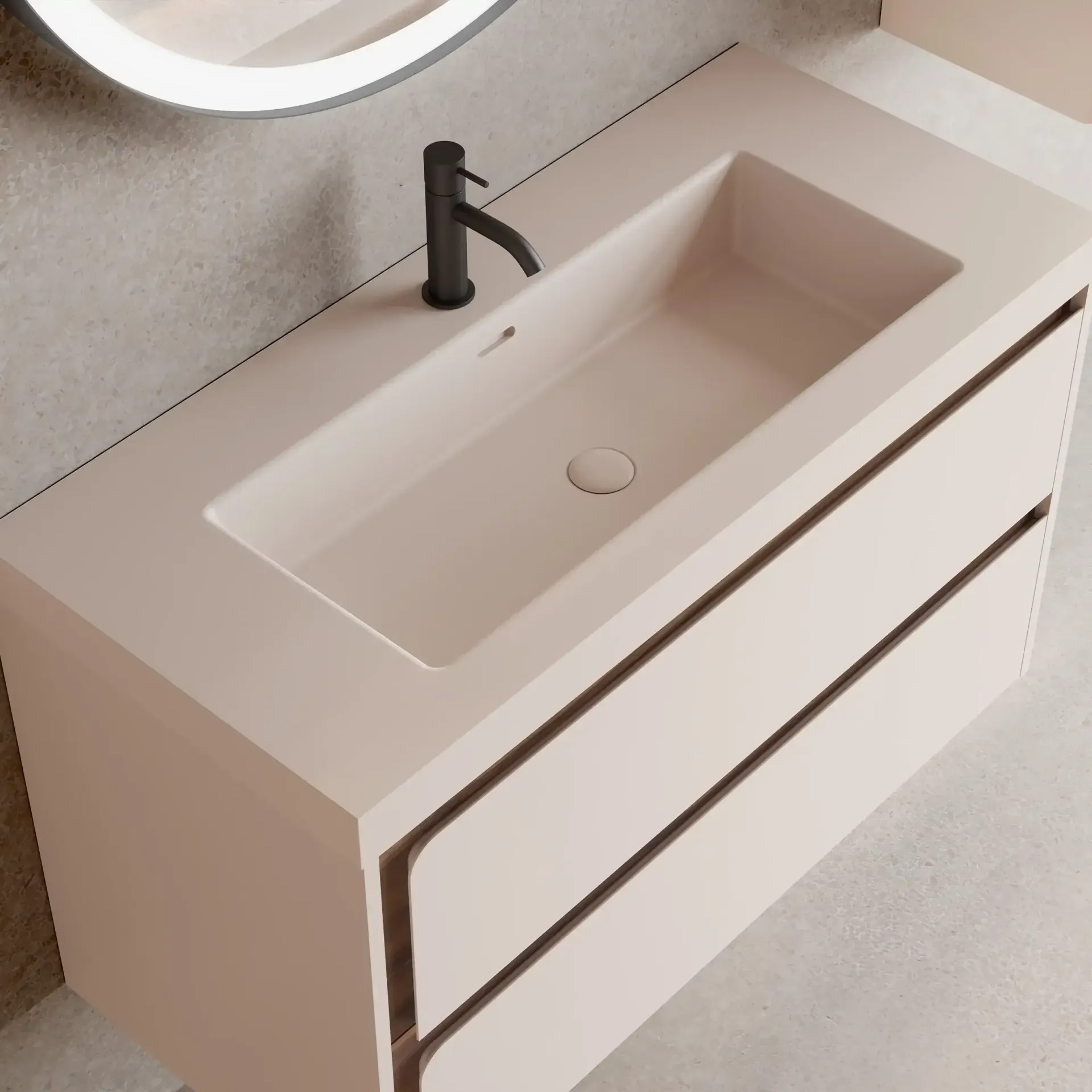 Tocador beige con lavabo rectangular y grifería negra; dos cajones con borde oscuro.