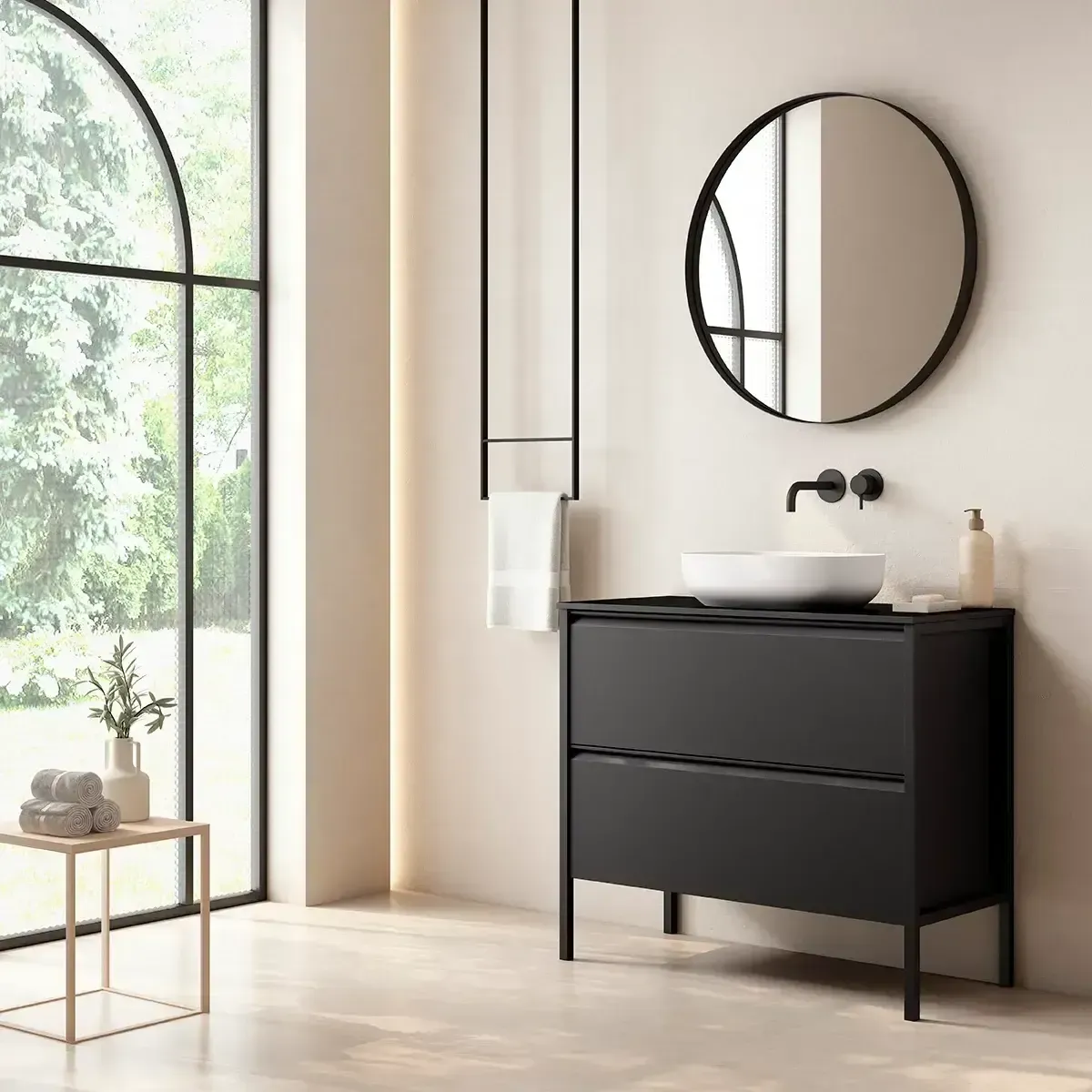 Mueble de baño negro con espejo redondo, lavabo blanco y ventana grande.