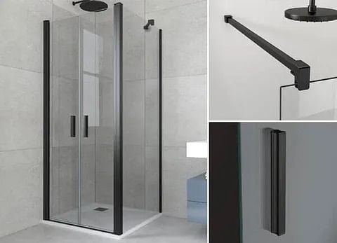 Mampara de ducha de cristal con marco negro en un baño alicatado. Los detalles muestran el cabezal y la manija de la ducha.