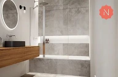 Baño moderno con tocador de madera, paredes de azulejos grises y mampara de ducha de cristal.