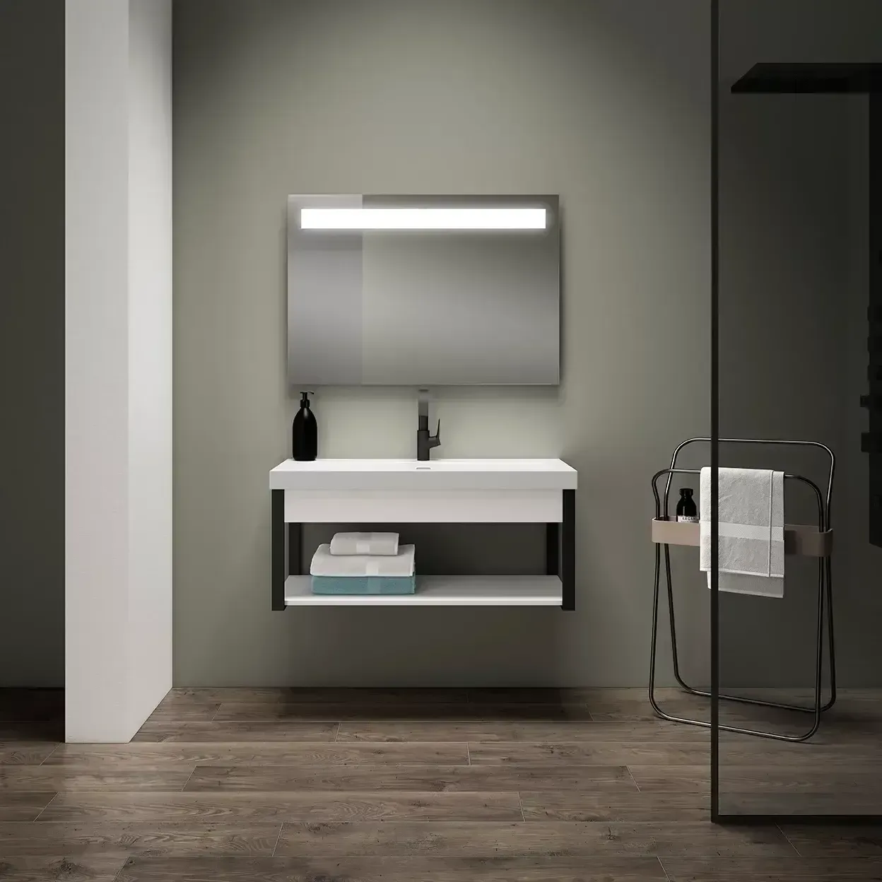 Baño moderno con tocador flotante blanco, espejo iluminado y toallero.