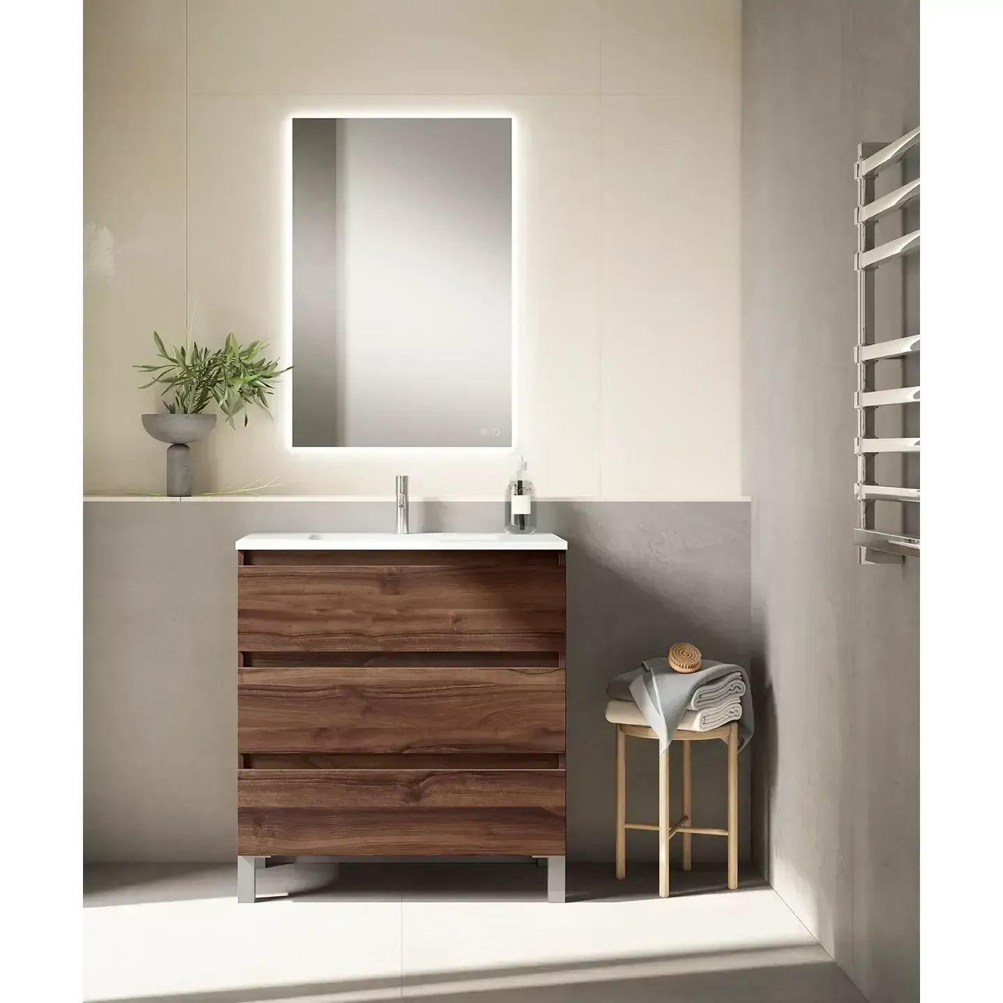 Tocador de baño con mueble imitación madera, encimera blanca, espejo iluminado y un pequeño taburete.