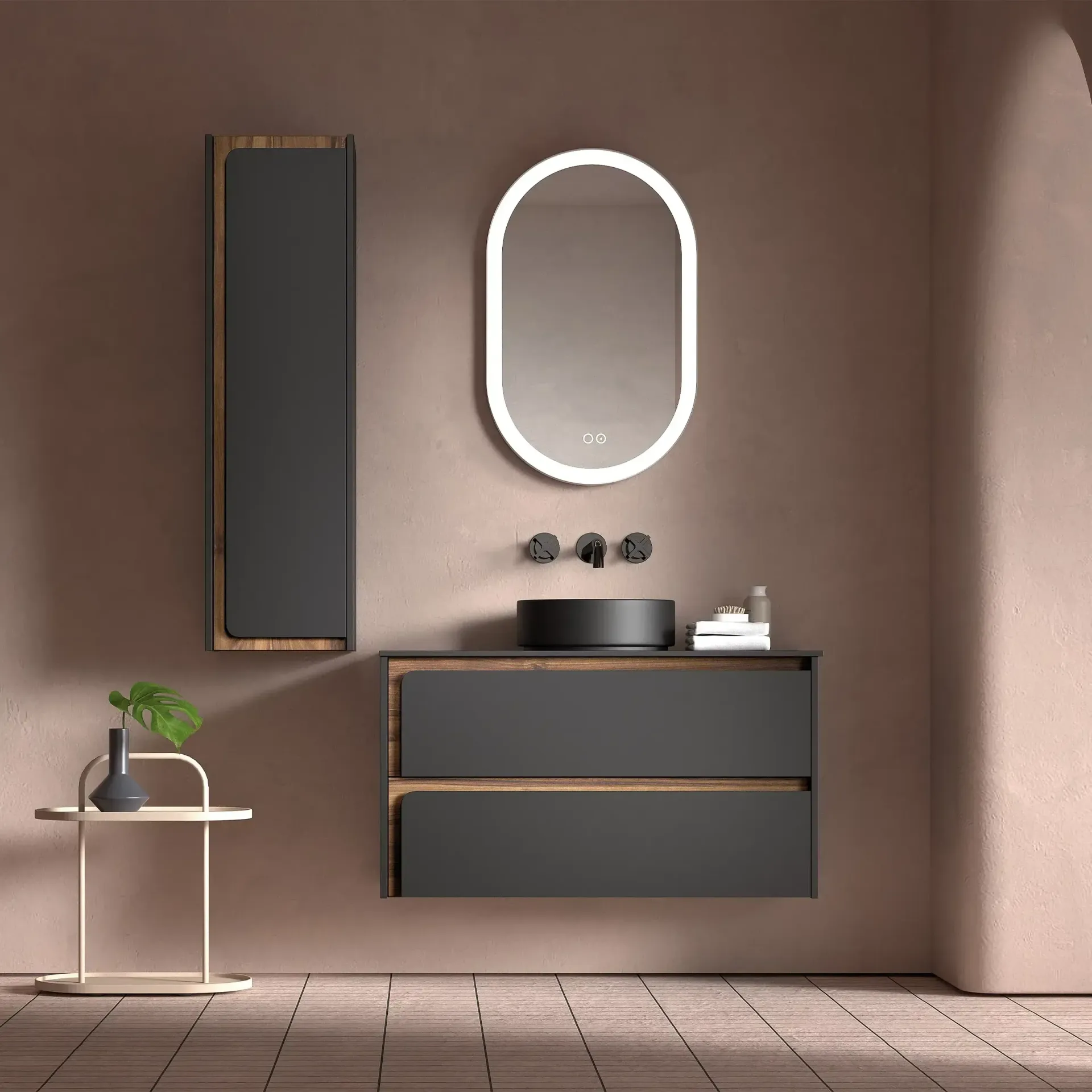 Baño moderno con tocador gris, lavabo negro, espejo ovalado y mueble alto.