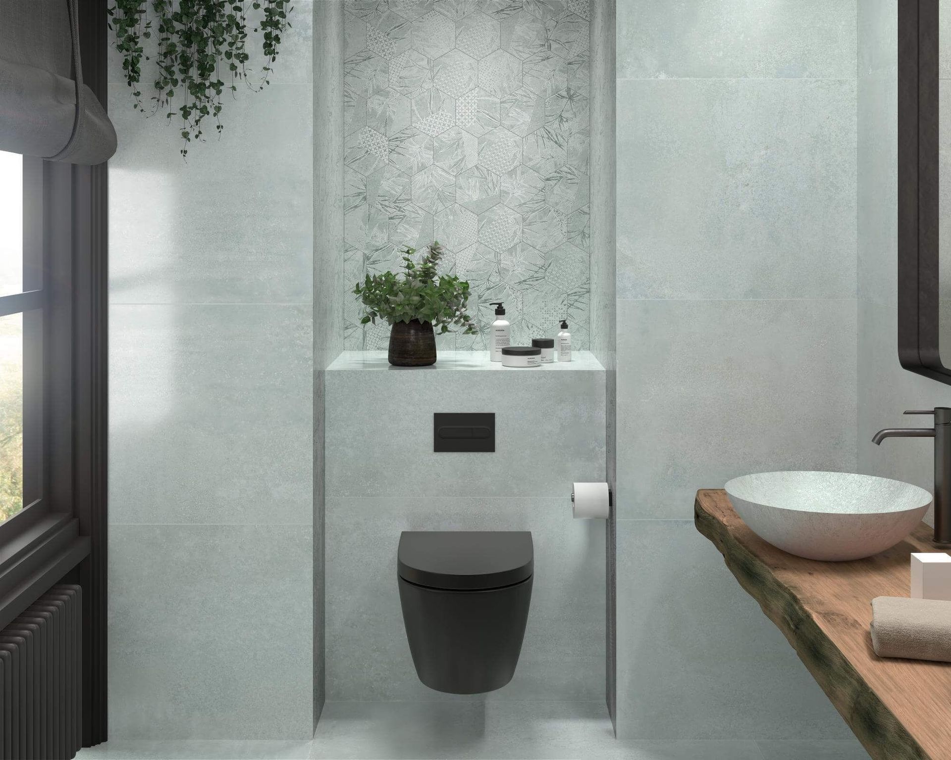Baño moderno con azulejos grises, inodoro negro, lavabo de madera y vegetación.