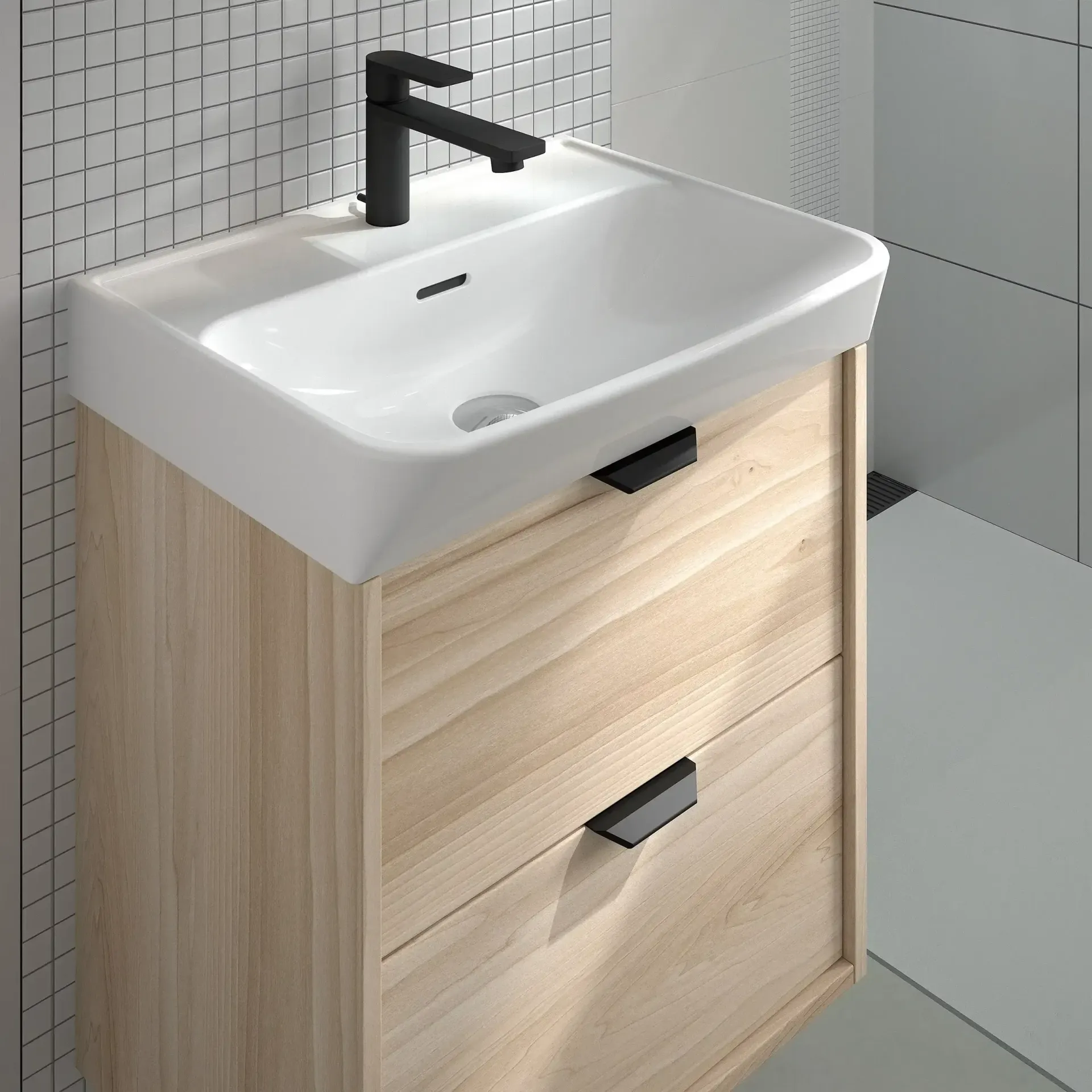 Mueble de baño con mueble de madera clara, lavabo blanco y grifería negra.