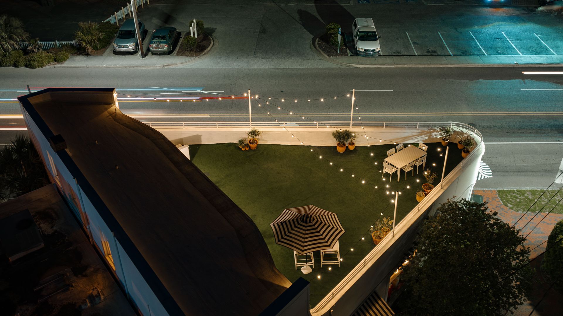 An aerial view of a rooftop garden at night.