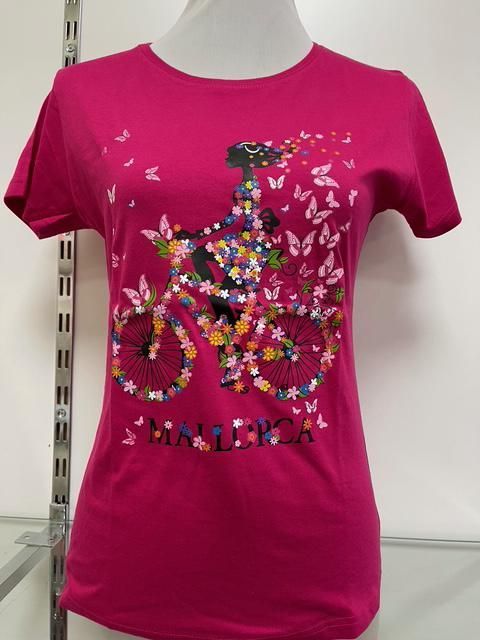 Camiseta rosa con diseño floral de bicicleta y texto 