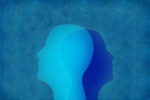 Una silueta de la cabeza de una persona con una sombra sobre un fondo azul.