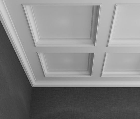 Una fotografía en blanco y negro de un techo blanco en una habitación.