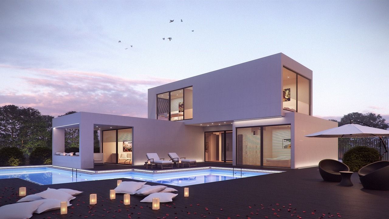 Una casa moderna con una gran piscina en frente de ella.