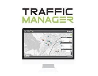 Interfaz del software Traffic Manager que muestra un mapa con iconos superpuestos en un monitor de escritorio. Texto verde y negro arriba.