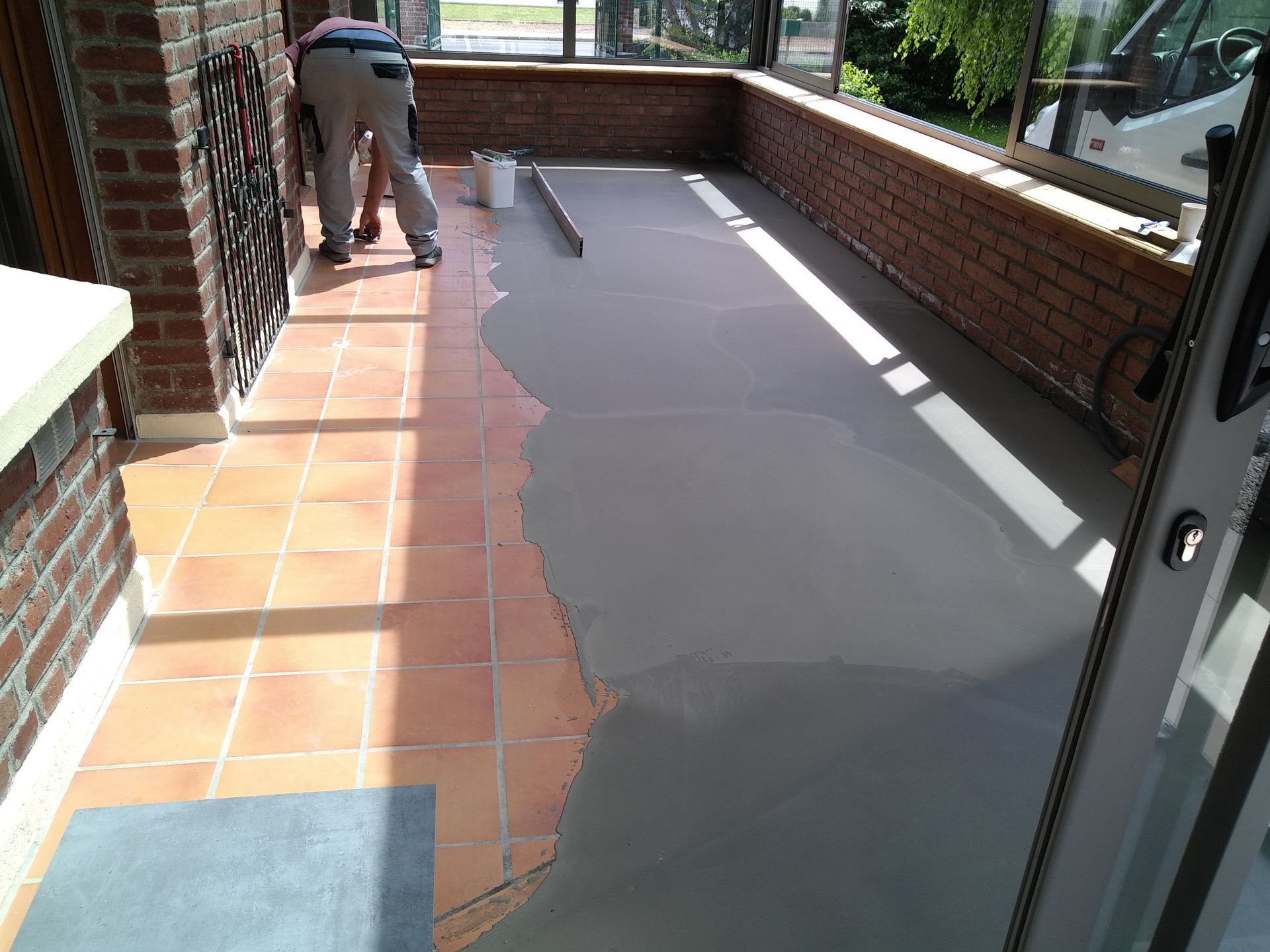 Chape de ragréage dans une véranda